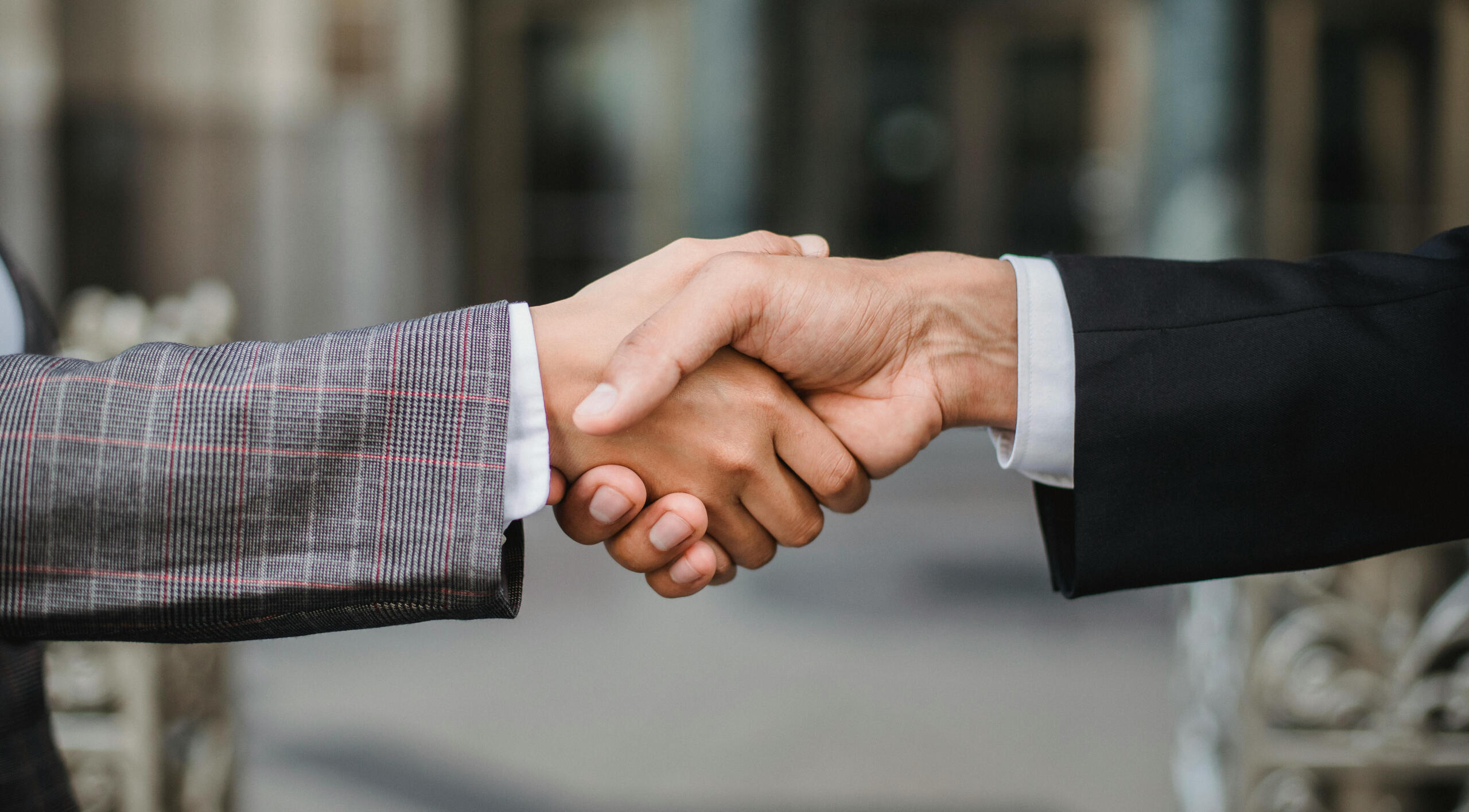 Reclaim Your Time – A handshake symbolizing partnership, trust, and the freedom to focus on what truly matters with expert virtual assistance.